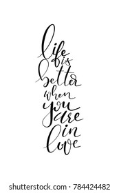 Hand drawn lettering. Ink illustration. Modern brush calligraphy. Isolated on white background. Life is better when you are in love.
