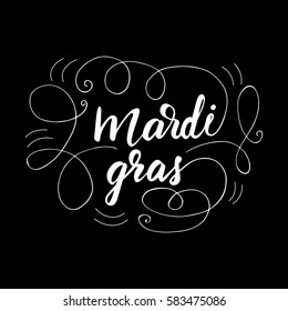 Hand drawn lettering "Mardi Gras" and flourishes. Vector illustration on black background.