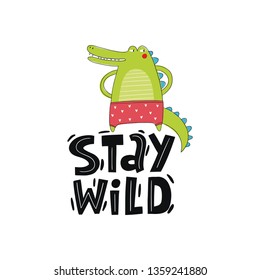 Hand drawn lettering Stay wild. Handwritten quote in modern style. Motivation vector quote with cartoon crocodile