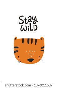 Hand drawn lettering Stay wild. Handwritten quote in modern style. Motivation vector quote with cartoon tiger