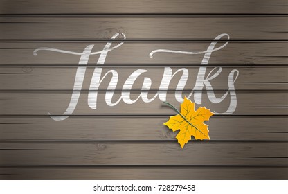 Hand drawn lettering text Thanks in white color on wooden texture background with yellow paper maple tree leaf, brush calligraphy text for thanksgiving day holiday design, EPS10, vector illustration