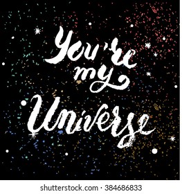 Hand drawn lettering You're my Universe on a dark background with stars and dust. EPS 10.