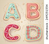 Hand drawn letters of the alphabet A through D in the shape of delicious and colorful cookies 