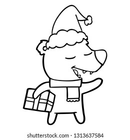hand drawn line drawing of a bear with present wearing santa hat