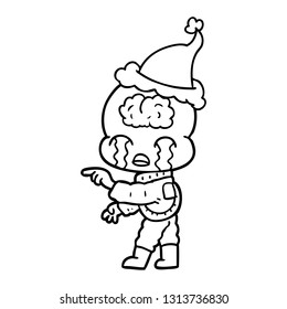 hand drawn line drawing of a big brain alien crying and pointing wearing santa hat