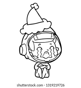 desenho de linha desenhada à mão de um astronauta chorando usando chapéu de Papai Noel