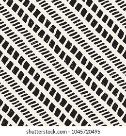 Hand drawn lines seamless grungy pattern. Abstract geometric repeating tile texture in black and white.