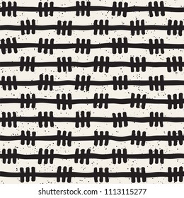 Hand drawn lines seamless grungy pattern. Abstract geometric repeating tile texture in black and white.