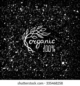 Hand drawn logo for 100%  organic products. White on noisy black background.