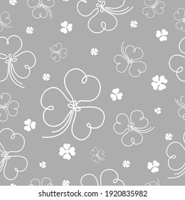 Hand drawn lucky clover seamless pattern on gray background. Vector illustration