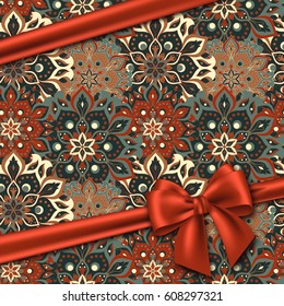 Hand drawn mandala pattern with realistic red bow. Vintage decorative elements in oriental style for your design. Vector illustration.