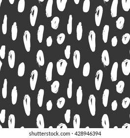 Hand drawn marker brush spots on black.Hand drawn seamless background.Rough hatched pattern. Fabric design.