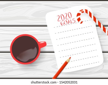 Hand drawn Mockup of New Year 2020 goals and resolutions. Flay lay with red coffee cup and candy cane