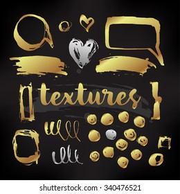 Hand Drawn monochrome texture elements set in gold over black. Vector illustration isolated on white. Abstract artistic ink hand painted spots. Text template. Grunge texture. Artist collection