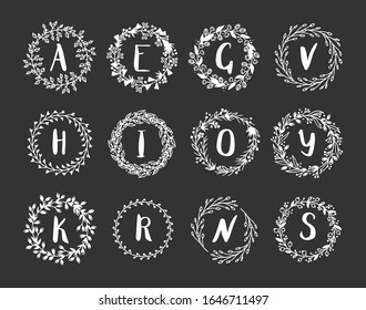 Hand drawn monogram object for design use.White Vector doodle flower on black chalk board  background and Capital Letter. Abstract pencil boho drawing twig. Artistic illustration elements plant
