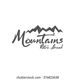 Hand Drawn Mountain Badge. Wilderness Old Style Typography Print, Web Label. Letterpress Print Rubber Stamp Effect. Retro Logo Design. Vector Inspirational Vintage Hipster Brand Design.