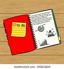 Hand drawn notebook with sticky note paper and quick doodles sketched in it isolated on wooden table background.