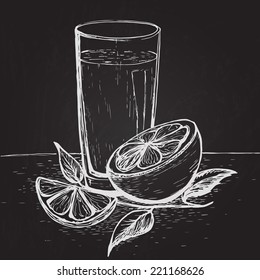 Hand drawn on the chalkboard juice with slices of orange and leaves