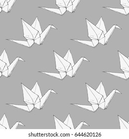 Hand drawn origami cranes on a gray background, monochrome vector seamless pattern
