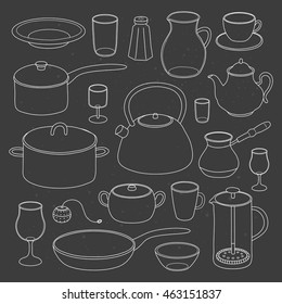 Hand drawn outline kitchen utensils and dishes isolated on the blackboard.