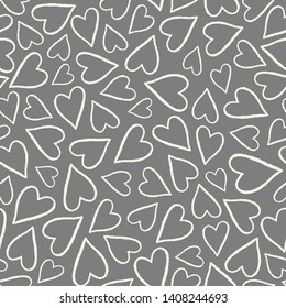 Hand drawn outlined hearts in a tossed pattern. A pretty vector seamless repeat pattern ideal for valentines fabric, scrap booking and stationery projects projects.