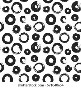 Hand drawn paint brush art texture of ink black rounds rings stains drops seamless background