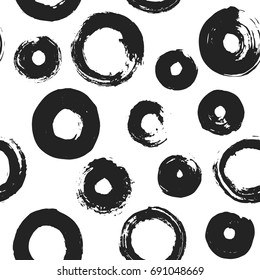 Hand drawn paint brush art texture of ink black rounds rings drops seamless background