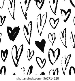 Hand drawn paint seamless pattern. Black and white hearts background. Abstract brush art drawing. Grunge Vector fashion illustration. Female texture