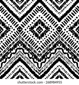 Hand drawn painted seamless pattern. Vector illustration for tribal design. Ethnic motif. Zigzag and stripe line. Black and white colors. For invitation, web, textile, wallpaper, wrapping paper.