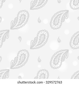 Hand drawn paisley and mehendi soft white seamless pattern. Light color line lace teardrop, pickle decoration items. Winter floral wedding decorative elements. 