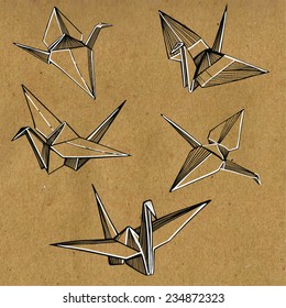 hand drawn paper cranes on a craft background