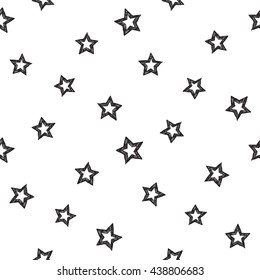 Hand drawn pen or ink shaded stars seamless patterns. Black outline sketch on white background.