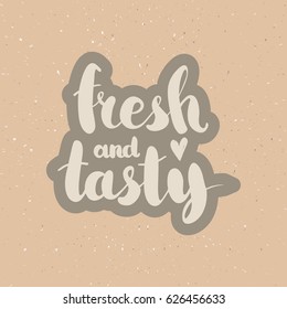 Hand drawn phrase Fresh and tasty. Lettering design for posters, t-shirts, cards, invitations, stickers, banners, advertisement. Vector.