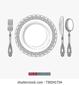 Hand drawn plate, spoon, fork and knife. Engraved style vector illustration. Elements for your design works.