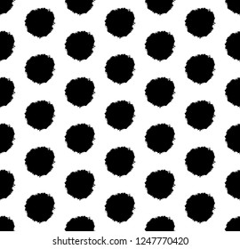 Hand drawn polka dot background with round brush strokes. Abstract stylish texture. Vector seamless pattern.