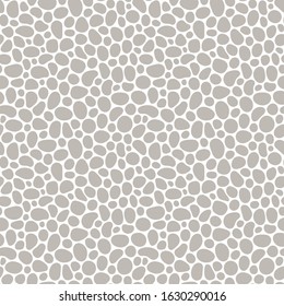 Hand drawn polka dot seamless pattern. Random geometric pebble wallpaper. Simple stones backdrop. Design for fabric, wrapping paper. Vector illustration