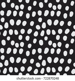 Hand drawn polka dots and spots seamless pattern. Abstract organic circular doodle shapes. Black and white simple brush texture. Decorative vector background for print, textile, web, or any use.
