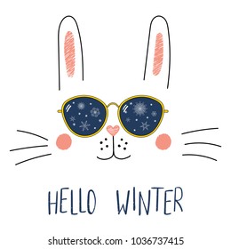 Hand drawn portrait of a cute cartoon funny bunny in sunglasses with snowflakes reflection, text Hello Winter. Isolated objects on white background. Vector illustration. Design for change of seasons.