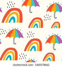 Hand drawn rainbows and umbrellas. Children's drawings style. Flat design. Vector seamless pattern. Colored trendy illustration for kids. Cartoon style. Flat design