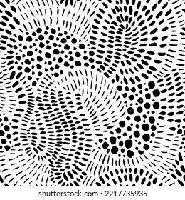 Hand drawn random dots and strokes seamless pattern. Seamless texture in ethnic style with different dashes, dots, short lines and splotches. Vector black and white doodle pattern.