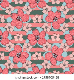Hand drawn red and pink Apple flowers with blue shadows on green and pink striped background. Colourful floral seamless vector pattern suitable for fashion fabrics, wallpapers, curtains and upholstery