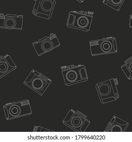 Hand drawn retro cameras sketch seamless pattern