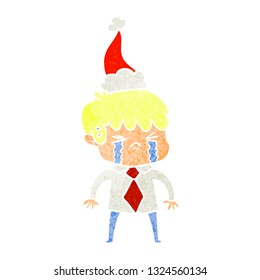 hand drawn retro cartoon of a boy crying wearing santa hat