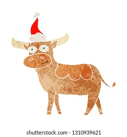 hand drawn retro cartoon of a bull wearing santa hat