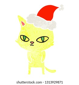 hand drawn retro cartoon of a cat with bright eyes wearing santa hat