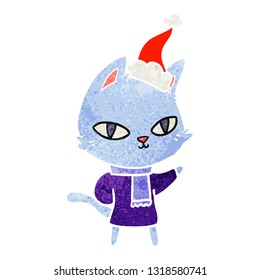 hand drawn retro cartoon of a cat staring wearing santa hat