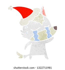 hand drawn retro cartoon of a crying wolf wearing santa hat