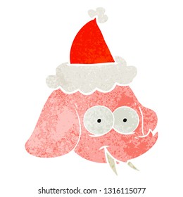 hand drawn retro cartoon of a elephant face wearing santa hat