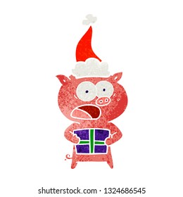 hand drawn retro cartoon of a pig with christmas present wearing santa hat