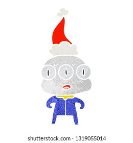 hand drawn retro cartoon of a three eyed alien wearing santa hat